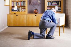 Person climbing onto a chair after suffering a fall