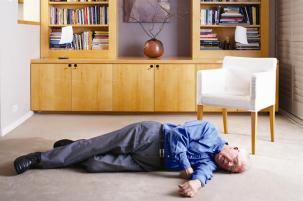 Person lying on floor after suffering a fall